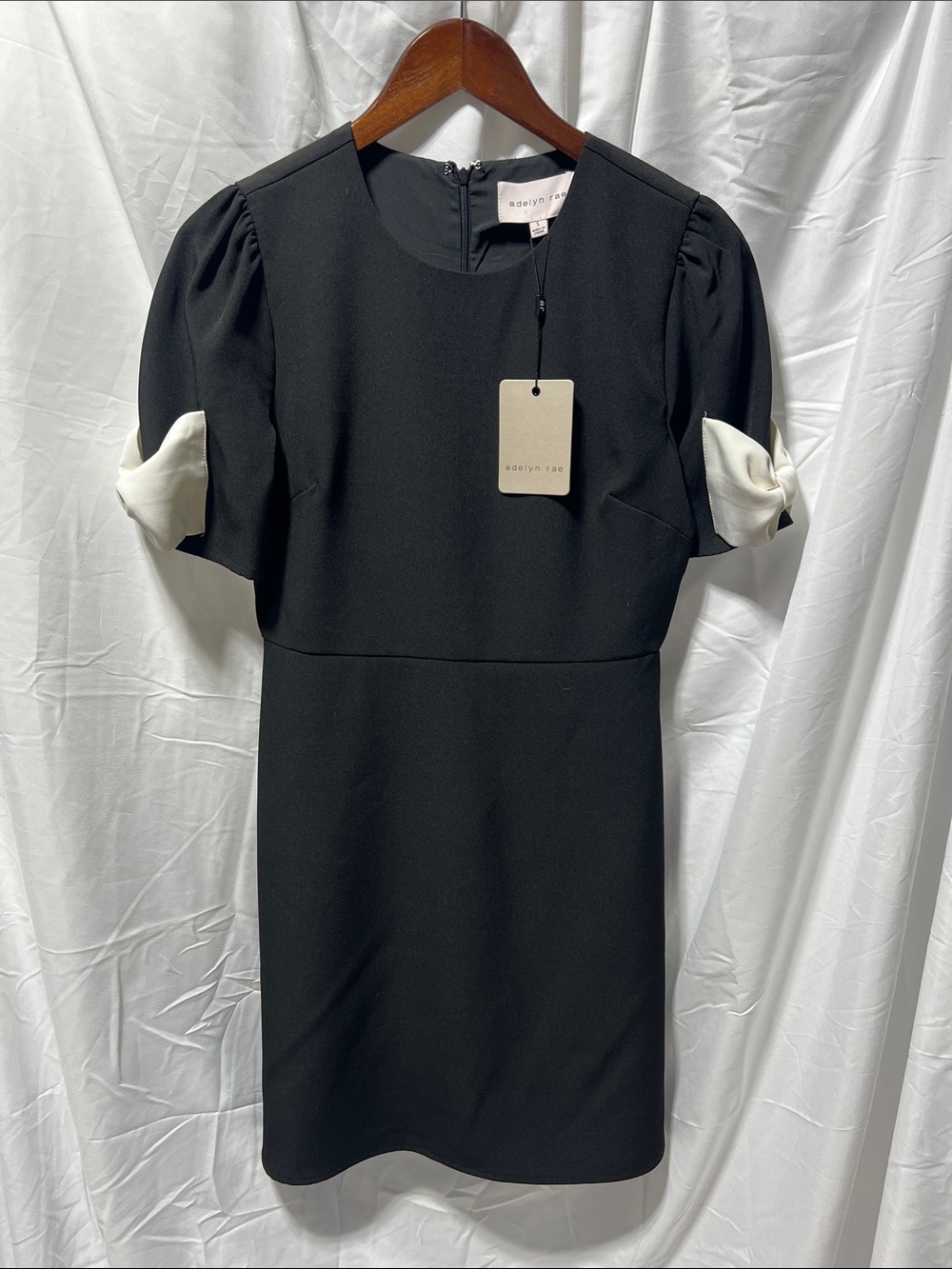Adelyn Rae Black Sheath Dress with White Sleeve Twist
